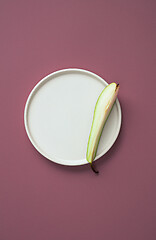 Image showing abstract flat lay composition with plate and pear slice