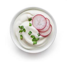 Image showing bowl of sour cream with radish and green onion