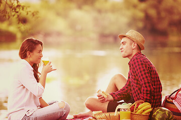 Image showing Couple in love enjoying picnic time