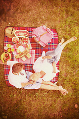 Image showing top view of couple enjoying picnic time