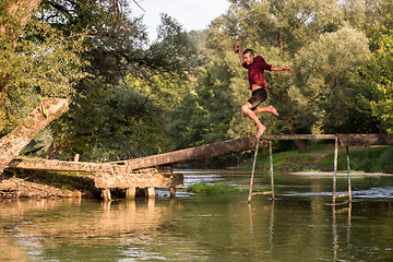 Image showing man jumping into the river