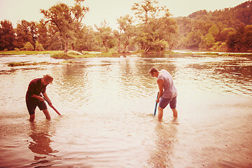 Image showing young men having fun with water guns