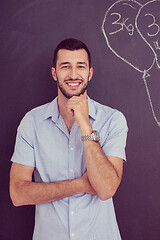 Image showing portrait of man in front of black chalkboard