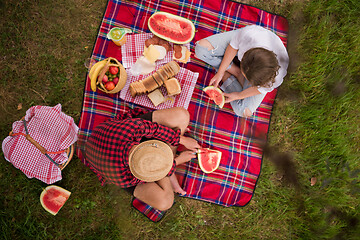 Image showing top view of couple enjoying picnic time