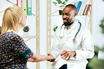 Image showing A senior woman visiting a therapist at the clinic