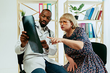 Image showing A senior woman visiting a therapist at the clinic