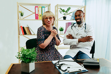 Image showing A senior woman visiting a therapist at the clinic