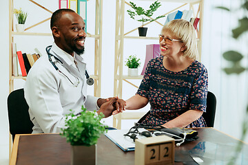 Image showing A senior woman visiting a therapist at the clinic