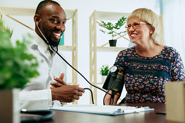 Image showing A senior woman visiting a therapist at the clinic