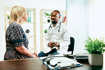 Image showing A senior woman visiting a therapist at the clinic