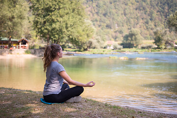 Image showing woman meditating and doing yoga exercise