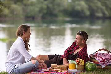 Image showing Couple in love enjoying picnic time