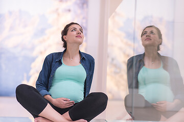 Image showing pregnant women sitting on the floor