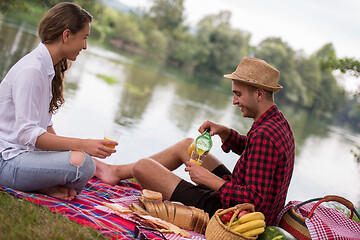 Image showing Couple in love enjoying picnic time