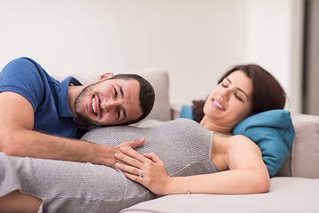 Image showing future dad listening the belly of his pregnant wife