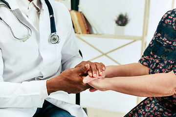 Image showing A senior woman visiting a therapist at the clinic