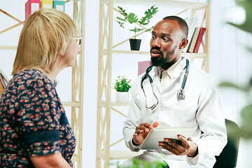 Image showing A senior woman visiting a therapist at the clinic