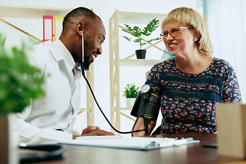 Image showing A senior woman visiting a therapist at the clinic