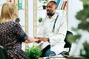 Image showing A senior woman visiting a therapist at the clinic