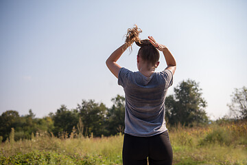 Image showing woman jogging along a country road