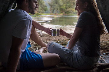 Image showing couple spending time together in straw tent