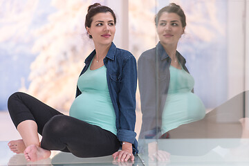 Image showing pregnant women sitting on the floor