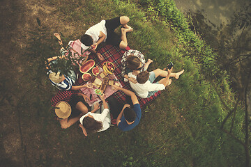 Image showing top view of group friends enjoying picnic time