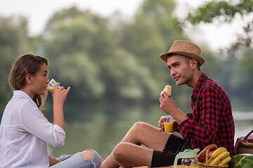 Image showing Couple in love enjoying picnic time