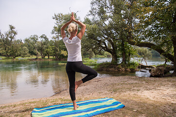 Image showing woman meditating and doing yoga exercise