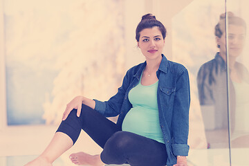 Image showing pregnant women sitting on the floor