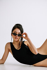 Image showing Young female ballet dancer against white studio background