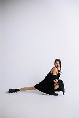 Image showing Young female ballet dancer against white studio background