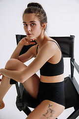 Image showing Young female ballet dancer against white studio background