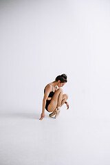 Image showing Young female ballet dancer against white studio background