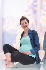 Image showing pregnant women sitting on the floor