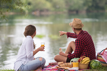 Image showing Couple in love enjoying picnic time