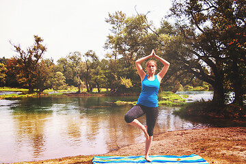 Image showing woman meditating and doing yoga exercise