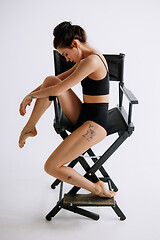 Image showing Young female ballet dancer against white studio background