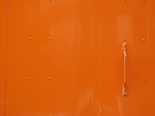 Image showing slick orange metal door