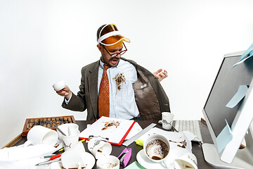 Image showing Young man spilled coffee on the white shirt