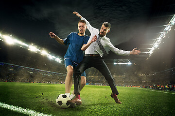 Image showing Office man as a soccer or football player at the stadium