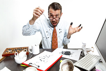 Image showing The young man with the broke pen and leaking ink