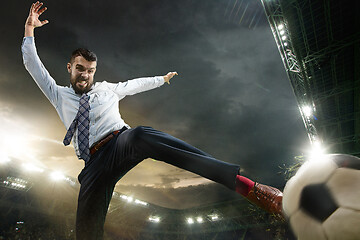 Image showing Office man as a soccer or football player at the stadium