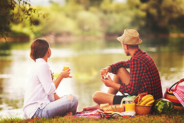 Image showing Couple in love enjoying picnic time