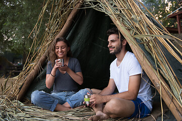 Image showing couple spending time together in straw tent