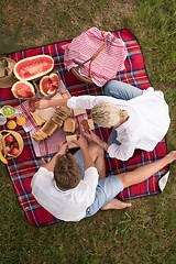 Image showing top view of couple enjoying picnic time