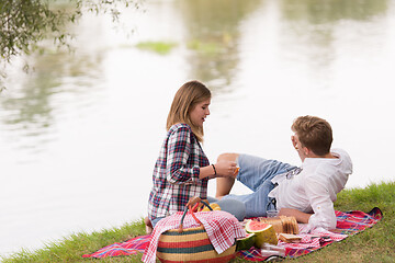 Image showing Couple in love enjoying picnic time