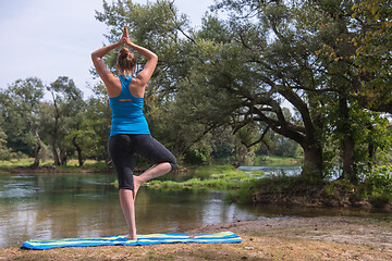 Image showing woman meditating and doing yoga exercise