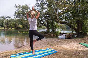 Image showing woman meditating and doing yoga exercise