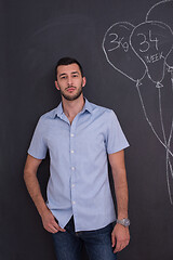 Image showing portrait of man in front of black chalkboard